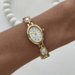 Marka Model Oval Tasarım Pembe & Mavi Baget Taşlı Kadranı Beyaz Gold Vintage Saat