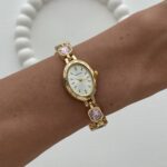 Marka Model Oval Tasarım Pembe & Siyah Baget Taşlı Kadranı Beyaz Gold Vintage Saat